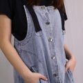 Model wearing Pinafore Dress Denim-Blue Closeup View