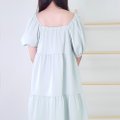 Model wearing Square Neck BabyDoll Dress-Green Back View