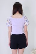 Model wearing Puffy Floral Top-Purple Back View