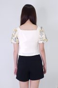 Model wearing Puffy Floral Top-Yellow Back View